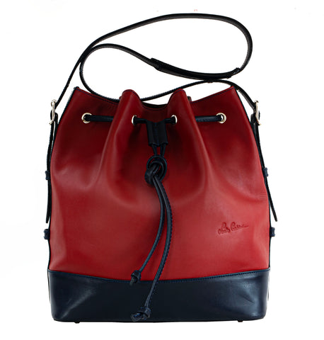 TRENDY - très BCBG (Bon Chic Bon Genre) very Preppy Trotter bag but much bigger with a top safe laced closure too a big open quick access- Can be a good bag for your next travel or working & shopping to carry on your shoulder daily.