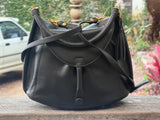 JUNO - A Spacier Judy Handbag with a new smart handle making the bag less rigid like standing Gard… and classier by articulating the handle with two knees that allow the handle to swivell! or Cross Body bag with a detachable and adjustable shoulder strap.
