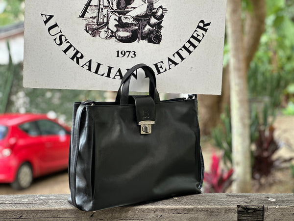 Loretta H - New! Handles and detachable and removable shoulder strap. Front strap over with turn lock.