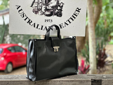 Loretta H - New! Handles and detachable and removable shoulder strap. Front strap over with turn lock.