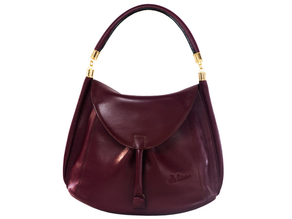 JUNO WITH A FIX FIRM HANDLE OR: 
MY NEW REDESIGN A LOSE HANDLE ARTICULATED WITH METALLIC LIKE ELBOWS SO YOUR HANDLE OUT OF YOUR SIGHT WHEN NOT IN USE, on the front or back of the bag. Your choices same prices.
