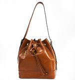 TRENDY - très BCBG (Bon Chic Bon Genre) very Preppy Trotter bag but much bigger with a top safe laced closure too a big open quick access- Can be a good bag for your next travel or working & shopping to carry on your shoulder daily.